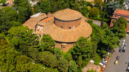 Aerial view of the Basilica of St. Stephen in the Round on the Celian Hill in Rome, Italy. It's a minor basilica and Hungary's national church in Rome. Its peculiarity is a circular roof. - obrazy, fototapety, plakaty