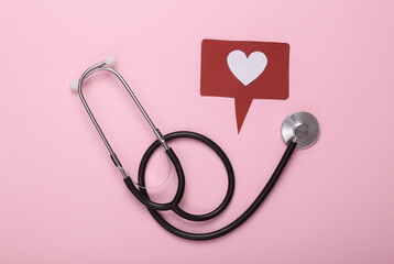 Stethoscope and like notification icon on a pink background. Social media. Rating, followers feedback. Top view