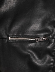 Zipper of leather jacket close up