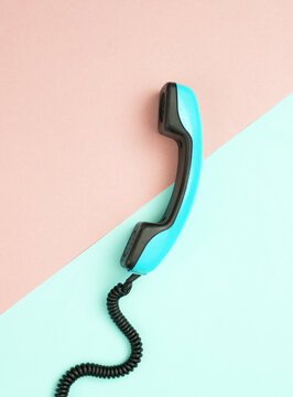 Retro cable phone tube on blue pink pastel background