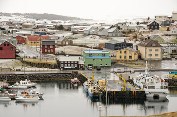 Stykkishólmur, Iceland, May 4, 2022: the town's harbour and colorful houses on a somewhat cold and rainy day in springtime