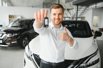 Man buying a car at a showroom