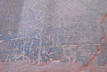 Petroglyphs carved on a stone wall in Utah.