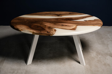 beautiful oval new table made of natural wood and white epoxy resin top view