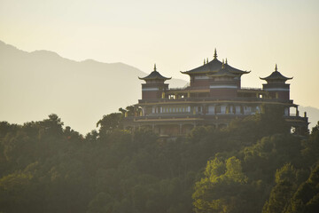 View to a misty monastery in a forest in Kathmandu, Nepal
