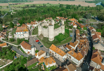 Aerial view of Billy castle in Central France with donjon, four semi circle towers and fortified...