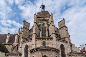 Collegiate church of Notre Dame in Beaune France with buttresses 13th-century church with Gothic & Renaissance elements houses historic 15th-century tapestries - obrazy, fototapety, plakaty
