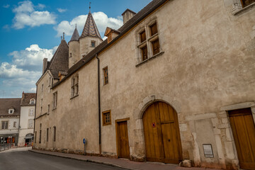 Fototapeta na wymiar Gothic palace with large windows next to the Hotel Dieu in Beaune France