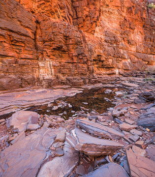 Little pool of water in the narrow slot canyon of Knox Gorge in Karijini National Park, Western Australia
