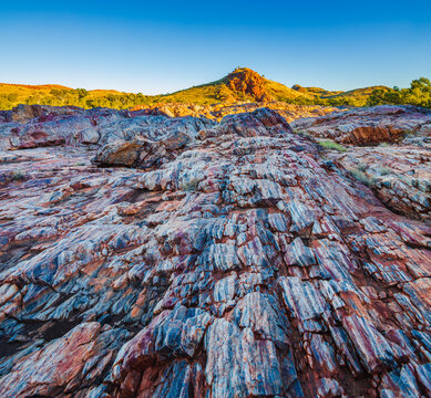 landscape at sunrise with colorful layers of Jasper in the vicinity of the village of Marble Bar, Western Australia