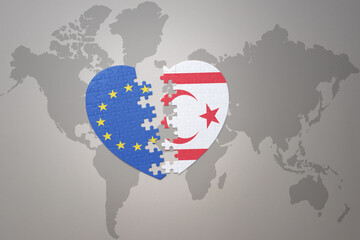 puzzle heart with the national flag of european union and northern cyprus on a world map background. Concept.