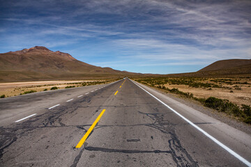 Fototapeta na wymiar National asphalt road in latin america. The concept of freedom on the highway. Empty road for background or text