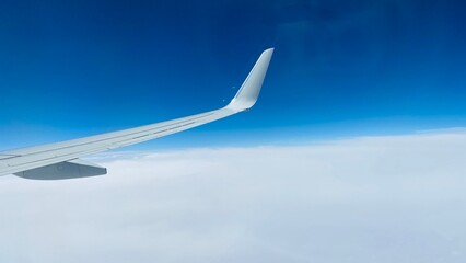 Fototapeta na wymiar airplane in the clouds