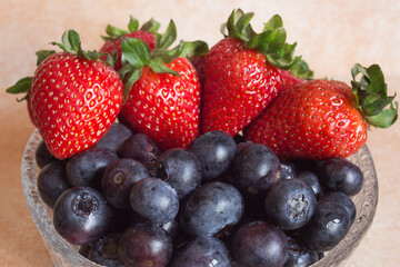 Close-up of blueberries and strawberries. Fruit and health.