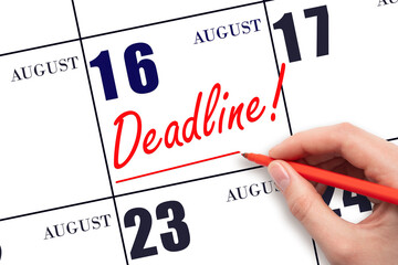 Hand drawing red line and writing the text Deadline on calendar date August 16. Deadline word...
