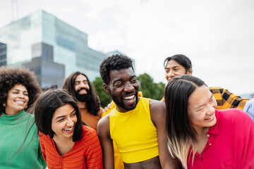 Young multiracial friends having fun together hanging out in the city - Friendship and diversity...