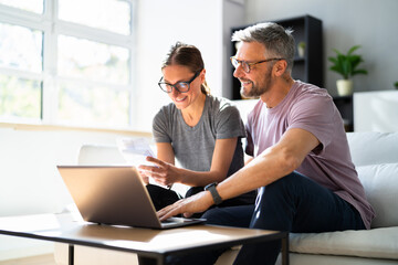 Couple Doing Taxes And Family Budget