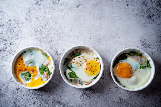 Spinach bacon baked egg in a baking dish