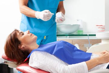 Obraz na płótnie Canvas Beautiful woman having dental treatment at dentist office.