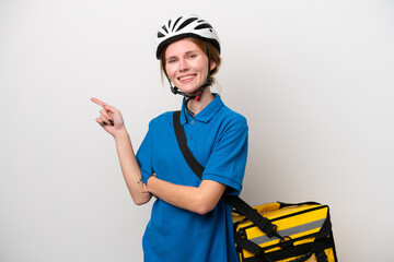 Young English woman with thermal backpack isolated on white background pointing finger to the side