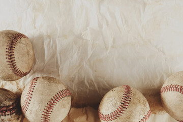 Old baseball sport background with wrinkles in texture of fabric by league balls from game.