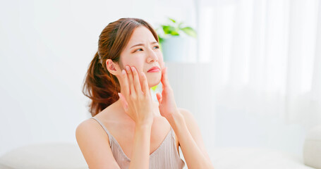 woman unhappy touch her face