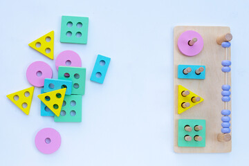 Colorful wooden toys for children on white background.
