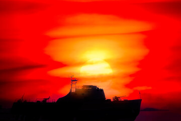 the evening sun shines red in the sky where a battleship is above the sea that is red from the sun, the scenery