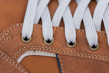 brown  sport shoe , metal ring detail for lace