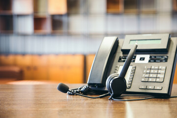 Headset and customer support equipment at call center ready for actively service , Communication support, call center and customer service help desk.for (call center) concept .