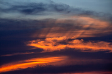 Naklejka na ściany i meble Dramatic sunrise sky with clouds.
