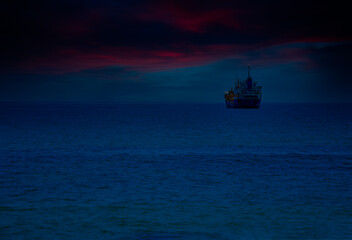 An oil tanker is sailing in the middle of the sea.