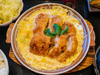 Close up shot of deep fried pork chop with egg