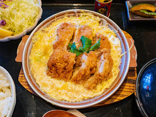 Close up shot of deep fried pork chop with egg