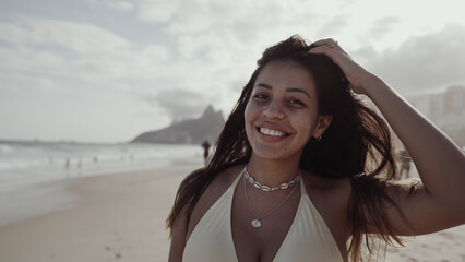 Latin young girl, famous beach Rio de Janeiro, Brazil. Latin summer vacation holiday.