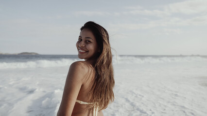 Latin young girl, famous beach Rio de Janeiro, Brazil. Latin summer vacation holiday.