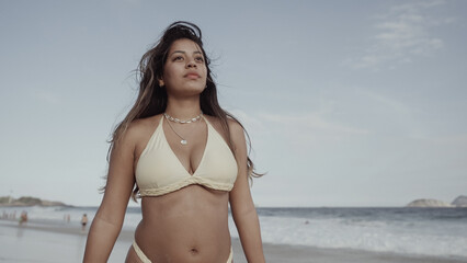 Latin young girl, famous beach Rio de Janeiro, Brazil. Latin summer vacation holiday. - obrazy, fototapety, plakaty