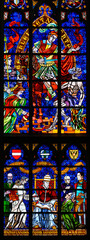 Stained-glass window depicting Catholic social reform, above Saint Martin of Tours, below Pope Leo XIII. Votivkirche – Votive Church, Vienna, Austria. 2020-07-29. 