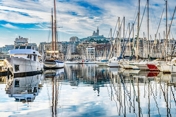 Fototapeta na wymiar Yachts Boats Waterfront Reflection Church Marseille France
