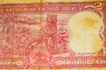 Fototapeta na wymiar Old Two Rupee notes combined on the table, India money on the rotating table. Old Indian Currency notes on a rotating table, Indian Currency on the table