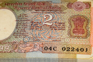 Old Two Rupee notes combined on the table, India money on the rotating table. Old Indian Currency notes on a rotating table, Indian Currency on the table