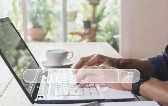 Business man searching and working with computer laptop on table at home. Working online business concept.