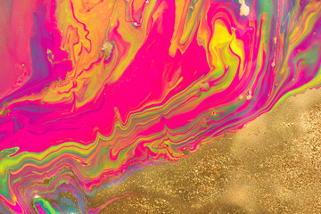 Fototapeta na wymiar Gold dust spots on liquid fluorescent paints background.