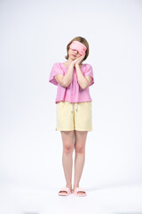 Portrait of Young beautiful woman sleeping with eye mask on white background.