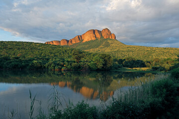 Scenic mountain landscape with water reflection, Marakele National Park, South Africa.