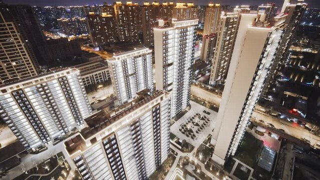 aerial view of high residential buildings in modern city at twilight
