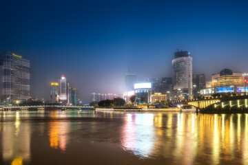 Fototapeta na wymiar Night view of the city along the Minjiang River in Fuzhou
