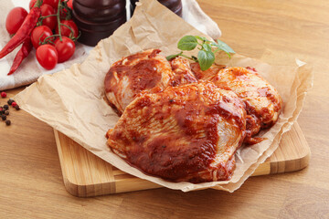 Marinated chicken leg in tomato sauce
