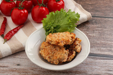 Fried salmonn cutlet in the bowl