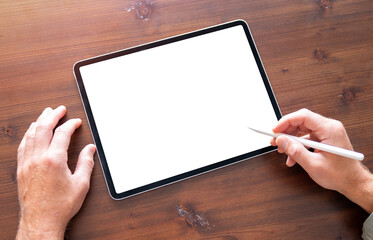 Closeup photo of person using digital tablet and stylus pen, empty screen mockup
